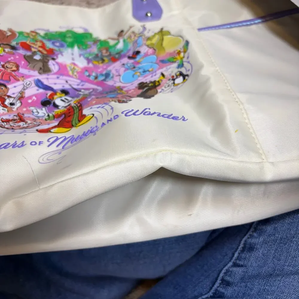 Disney 100 yrs of Music & Wonder tote bag. cream, shimmer purple. Never used